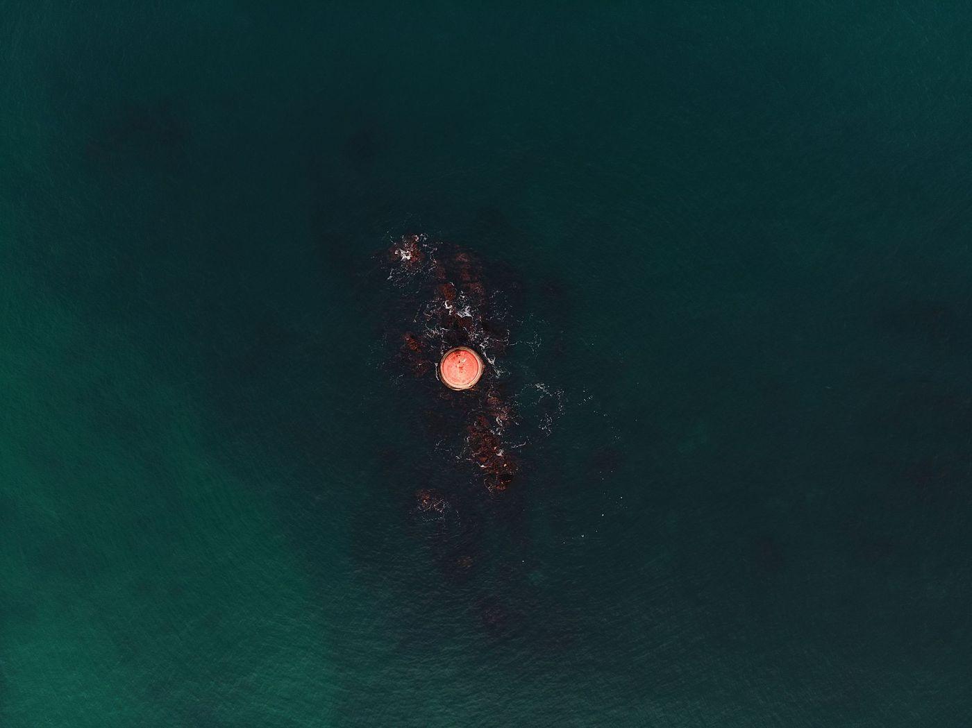 An instrumented monitoring buoy riding a light swell